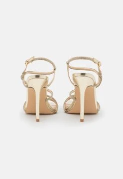 Steve Madden Implicit - Sandalen Met Hoge Hak - Gold -Fashionista Verkoop dbdc72082a8546dcb0d57284637955b2 scaled